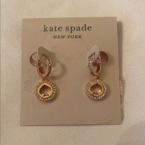 kate spade rose gold crystal spade drop earrings.